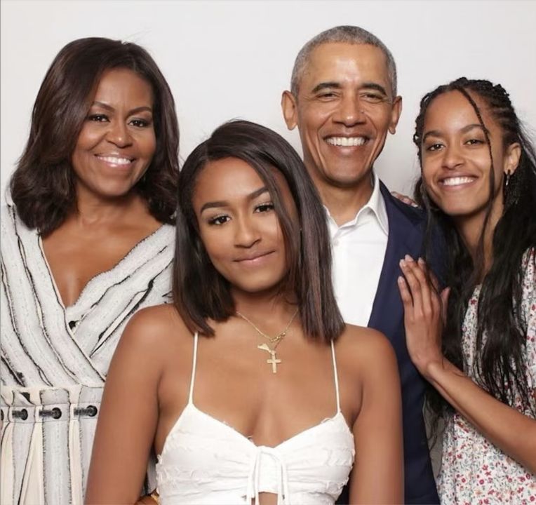 Michelle Obama with her husband and kids.